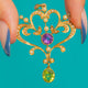 15ct Gold Amethyst, Peridot and Pearl pendant, front view of the scrollwork and oval drop