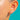 Mid-century Gold double-ball stud earring, wider worn view